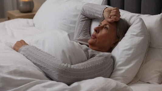A woman lying on a bed.