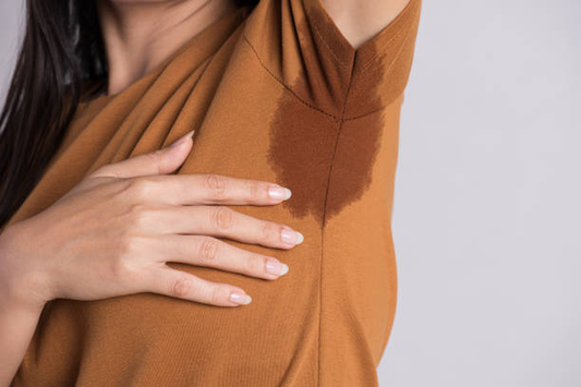 A woman showing off her sweaty armpit